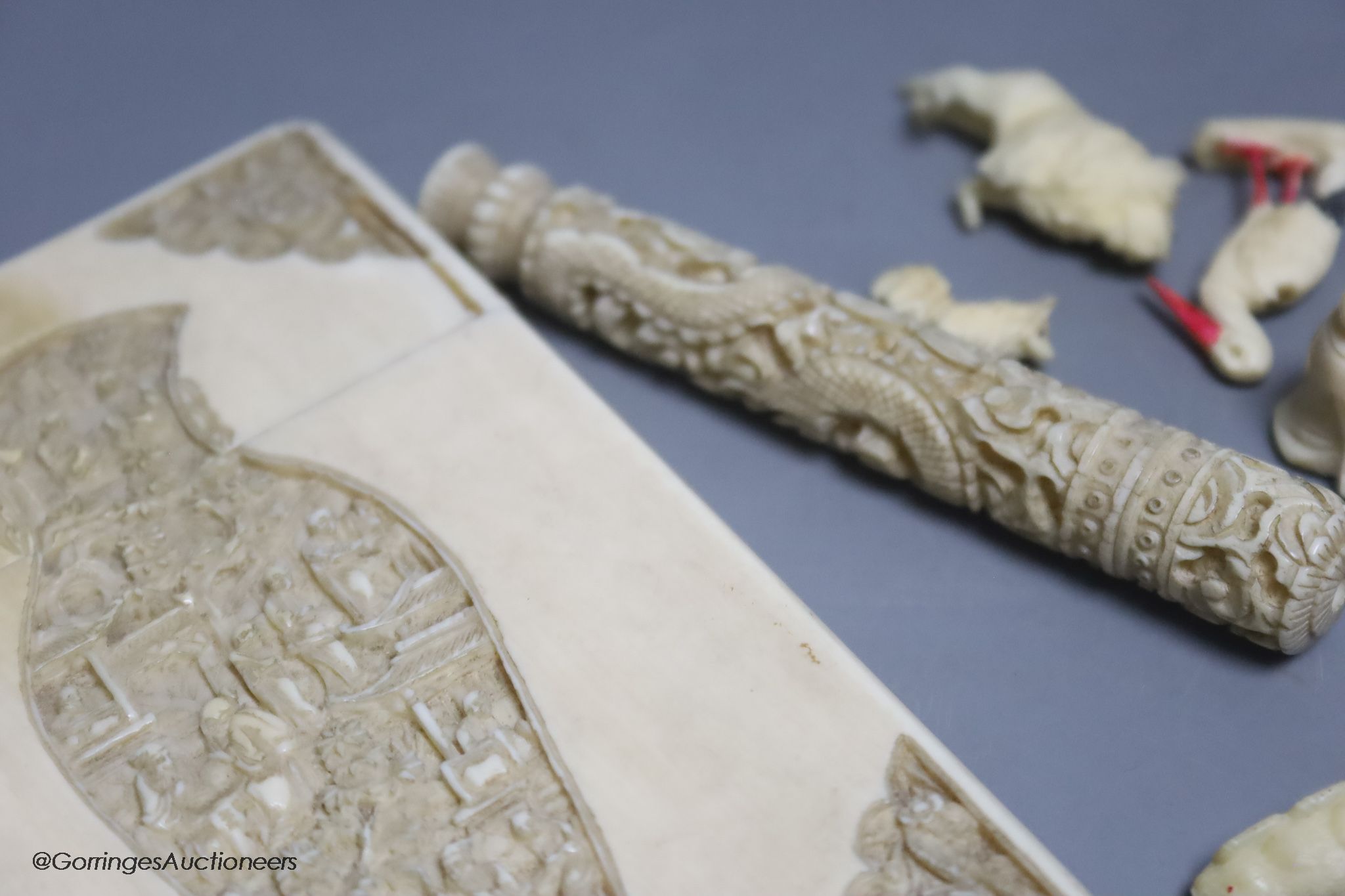 A late 19th century Chinese carved ivory card case, a similar needle case, an aide-memoire and sundries